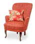 Mia armchair in fabric Idol color 1 Red, legs in dark brown lased.
Cushion in burgundy floral fabric Cathrine
